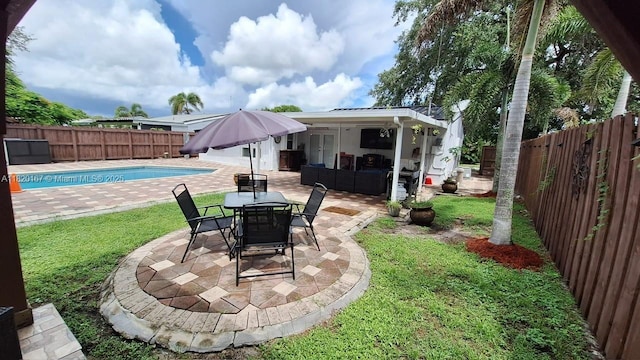 6810 Douglas St, Hollywood, FL 33024 - fenced backyard featuring a patio and an outdoor living space