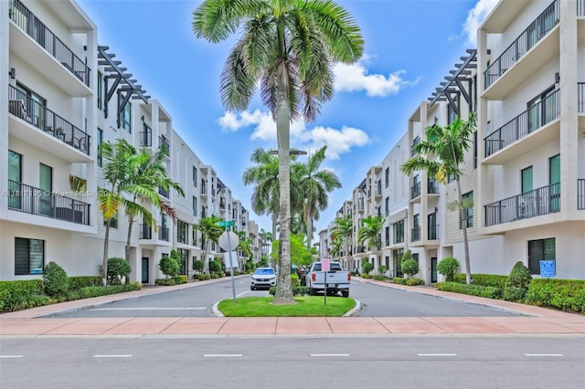 4740 NW 84th Ct Unit 38, Doral, FL 33166 - view of asphalt street featuring a residential view, traffic signs, curbs, and sidewalks