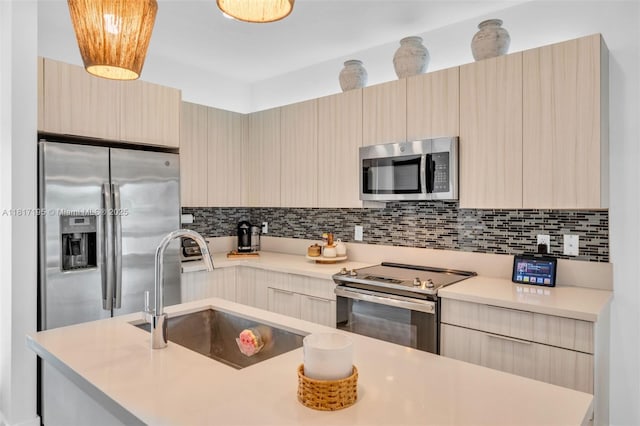 4740 NW 84th Ct Unit 38, Doral, FL 33166 - kitchen with appliances with stainless steel finishes, modern cabinets, and light countertops