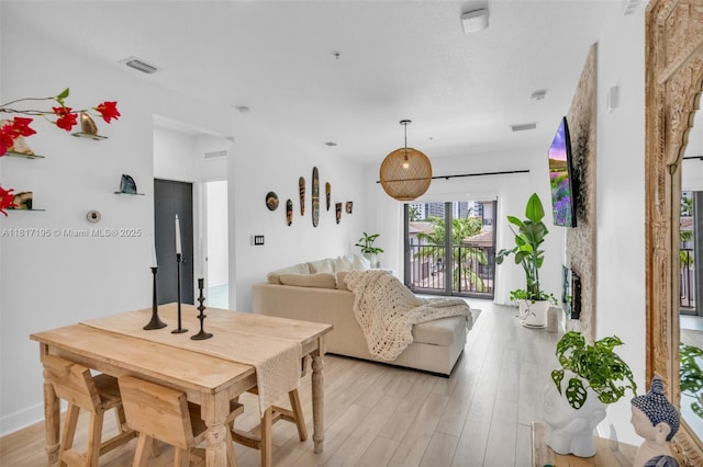 4740 NW 84th Ct Unit 38, Doral, FL 33166 - dining area featuring light wood-style flooring