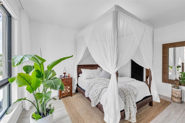 4740 NW 84th Ct Unit 38, Doral, FL 33166 - bedroom featuring multiple windows and wood finished floors