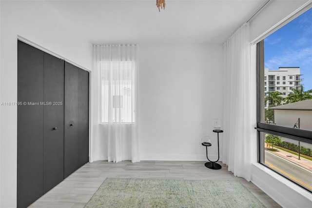 4740 NW 84th Ct Unit 38, Doral, FL 33166 - unfurnished bedroom featuring wood finished floors and a closet