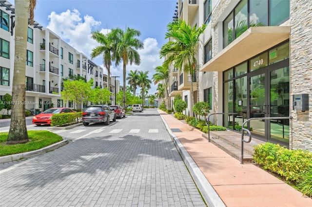 4740 NW 84th Ct Unit 38, Doral, FL 33166 - view of street featuring curbs, sidewalks, and a residential view