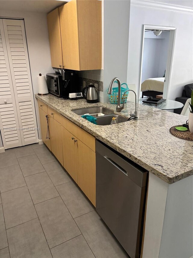 1900 Van Buren St Unit 209B, Hollywood, FL 33020 - kitchen with stainless steel dishwasher, light tile patterned floors, light stone countertops, a peninsula, and backsplash
