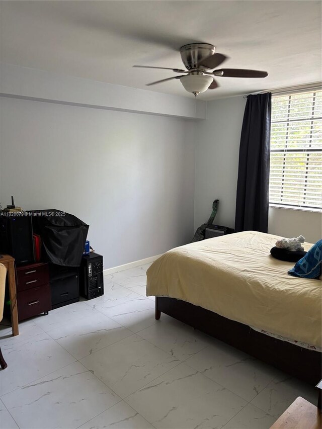 1900 Van Buren St Unit 209B, Hollywood, FL 33020 - bedroom featuring light marble finish flooring and ceiling fan