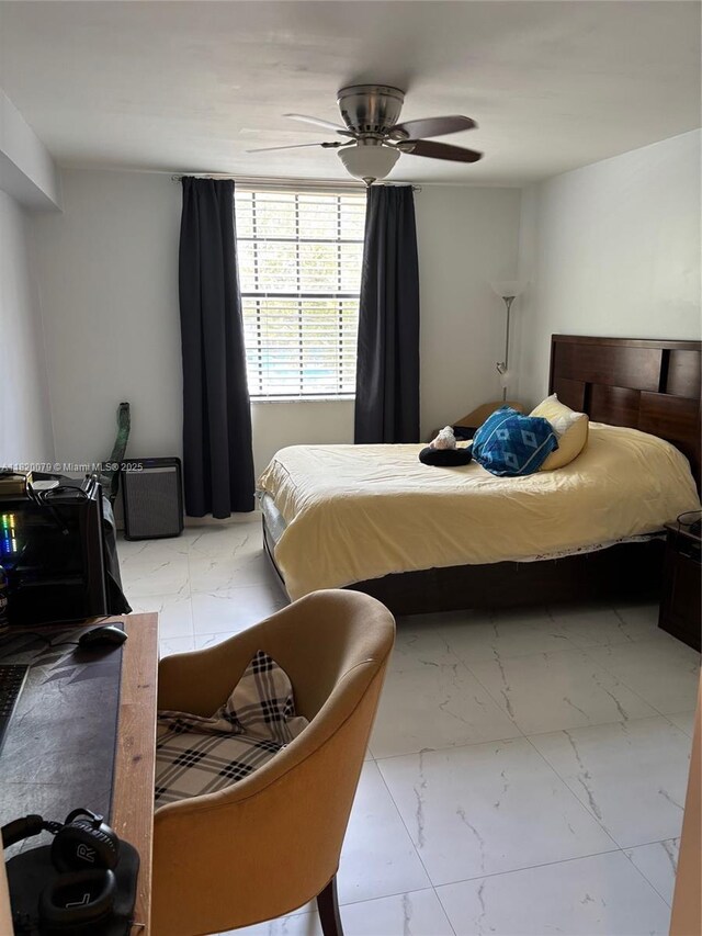 1900 Van Buren St Unit 209B, Hollywood, FL 33020 - bedroom featuring light marble finish floors and a ceiling fan