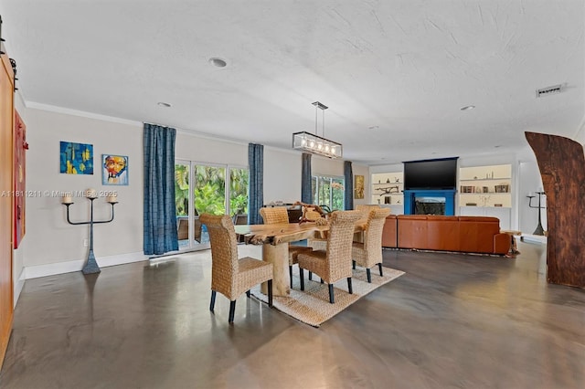 901 W Tropical Way, Plantation, FL 33317 - dining area featuring concrete flooring, built in features, crown molding, and a fireplace