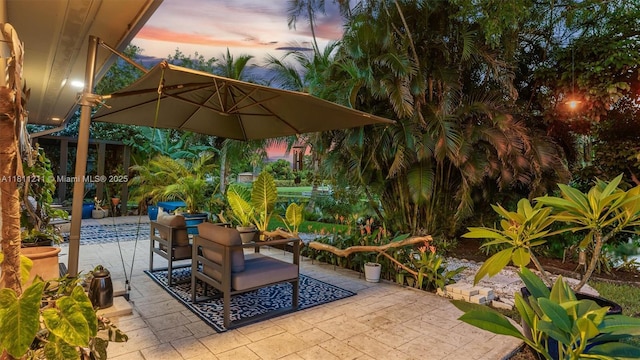 901 W Tropical Way, Plantation, FL 33317 - patio terrace at dusk featuring a patio area