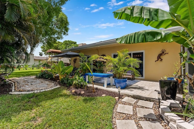 901 W Tropical Way, Plantation, FL 33317 - view of grassy yard with a patio area