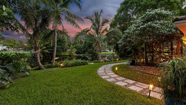 901 W Tropical Way, Plantation, FL 33317 - yard at dusk featuring a yard and a water view