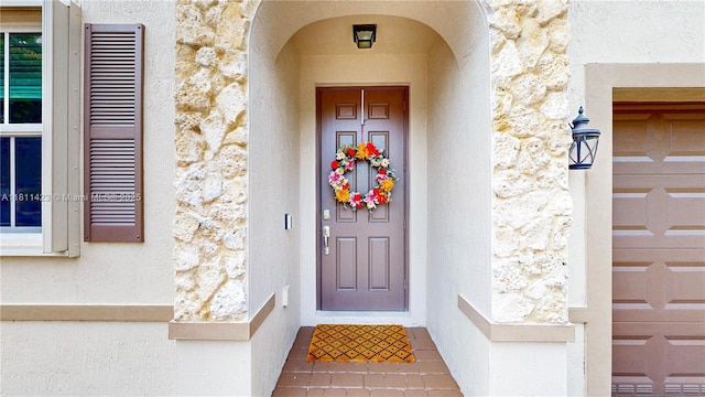 2389 NE 4th St, Homestead, FL 33033 - doorway to property with stone siding and stucco siding