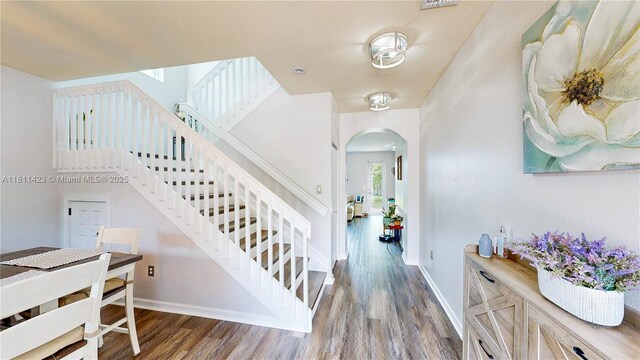 2389 NE 4th St, Homestead, FL 33033 - stairs with arched walkways and wood finished floors