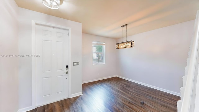 2389 NE 4th St, Homestead, FL 33033 - entrance foyer featuring dark wood-type flooring and a chandelier