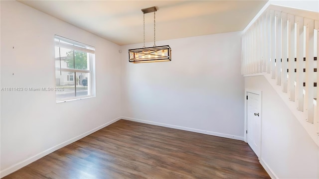 2389 NE 4th St, Homestead, FL 33033 - spare room with dark wood-style floors and baseboards