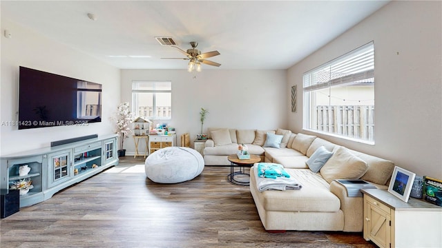2389 NE 4th St, Homestead, FL 33033 - living room with healthy amount of natural light, wood finished floors, and ceiling fan