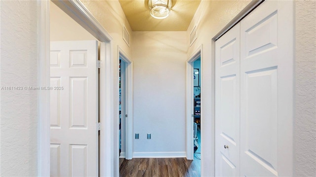 2389 NE 4th St, Homestead, FL 33033 - hallway featuring dark wood-style flooring and a textured wall