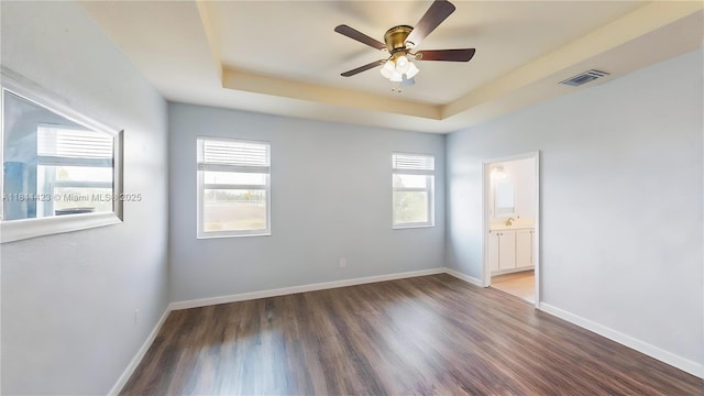 2389 NE 4th St, Homestead, FL 33033 - empty room with a tray ceiling, ceiling fan, and wood finished floors