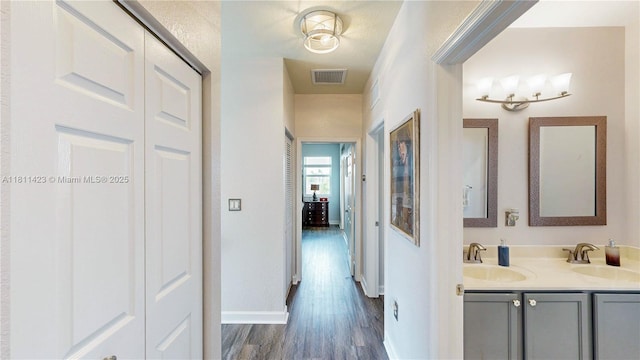 2389 NE 4th St, Homestead, FL 33033 - hall featuring a sink and dark wood finished floors