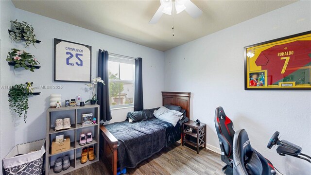 2389 NE 4th St, Homestead, FL 33033 - bedroom featuring wood finished floors and a ceiling fan