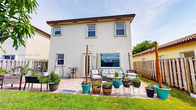 2389 NE 4th St, Homestead, FL 33033 - back of house featuring a patio, a fenced backyard, stucco siding, and an outdoor living space