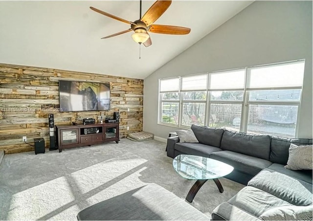680 NW 111th Way, Coral Springs, FL 33071 - living area featuring wooden walls, carpet, ceiling fan, and high vaulted ceiling