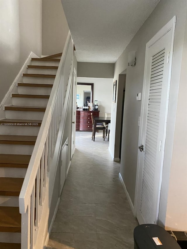 721 SE 1st Way Unit B18, Deerfield Beach, FL 33441 - staircase featuring a textured ceiling