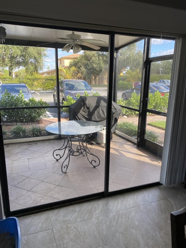 721 SE 1st Way Unit B18, Deerfield Beach, FL 33441 - unfurnished sunroom featuring ceiling fan and healthy amount of natural light