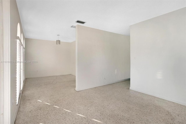 3421 SW 4th St, Miami, FL 33135 - unfurnished room with speckle patterned floor and baseboards
