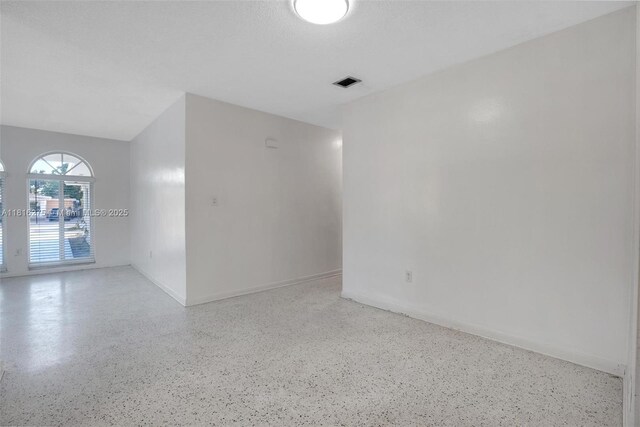 3421 SW 4th St, Miami, FL 33135 - unfurnished room featuring speckled floor and baseboards