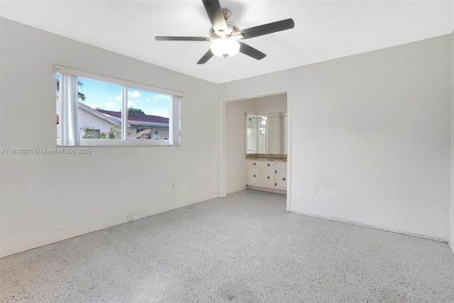 3421 SW 4th St, Miami, FL 33135 - empty room featuring dark aggregate flooring and a ceiling fan