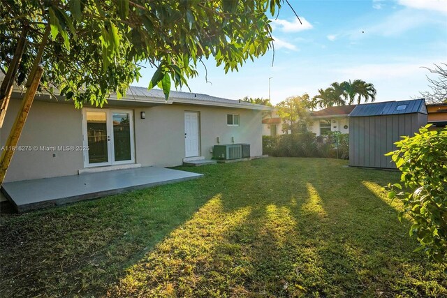 3421 SW 4th St, Miami, FL 33135 - view of grassy yard with a storage unit