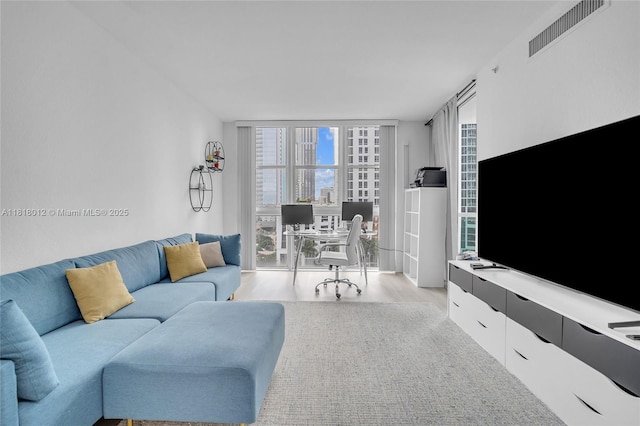 500 NE 29th St Unit 905, Miami, FL 33137 - living room with floor to ceiling windows, light wood-type flooring, and an office area