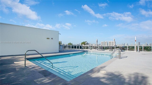 2001 Meridian Ave Unit 516, Miami Beach, FL 33139 - community pool featuring a patio and a view of city