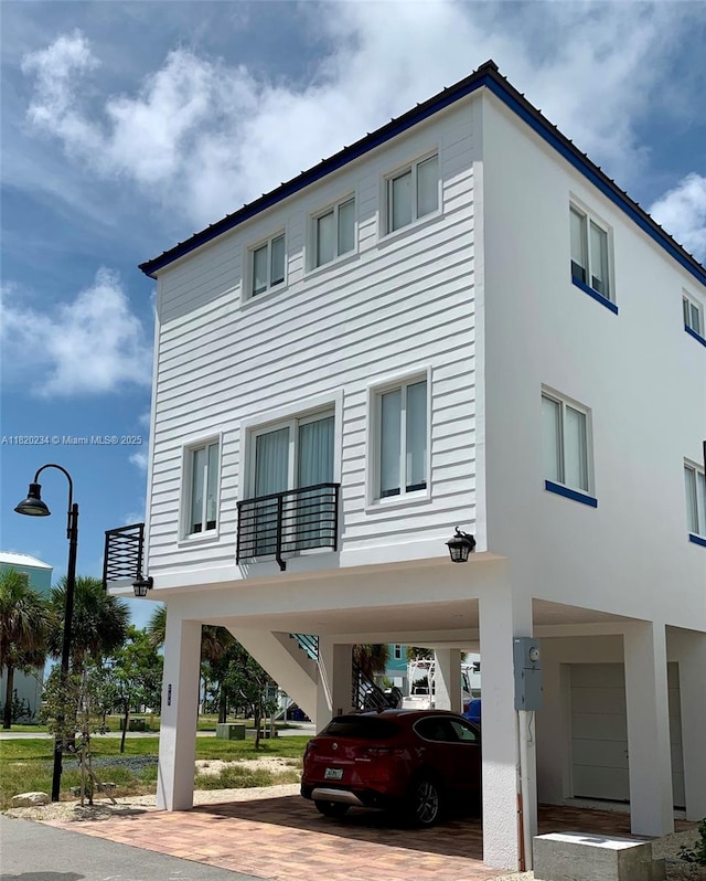 94825 Overseas Hwy, Key Largo, FL 33037 - view of property with a carport and decorative driveway