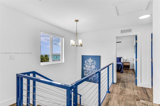 94825 Overseas Hwy, Key Largo, FL 33037 - hallway featuring an upstairs landing and wood finished floors