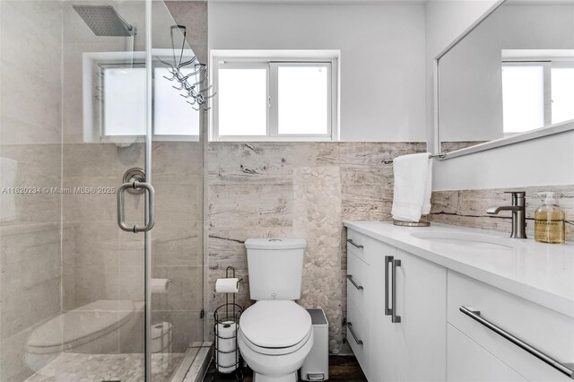 94825 Overseas Hwy, Key Largo, FL 33037 - bathroom featuring vanity, a shower stall, and tile walls