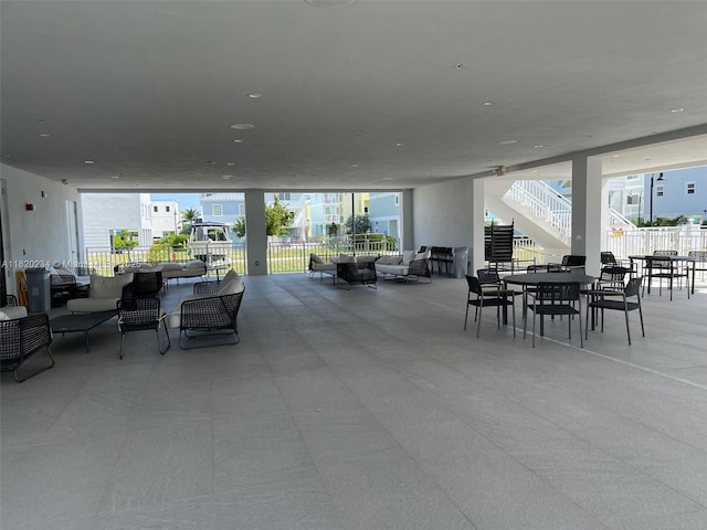 94825 Overseas Hwy, Key Largo, FL 33037 - view of patio featuring stairs, an outdoor living space, and outdoor dining area