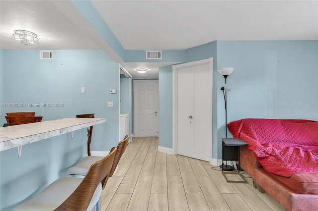 251 W Palm Cir W Unit 207, Pembroke Pines, FL 33025 - hall with light wood-type flooring and baseboards