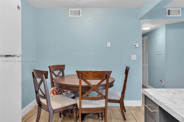 251 W Palm Cir W Unit 207, Pembroke Pines, FL 33025 - dining space with light wood finished floors and baseboards