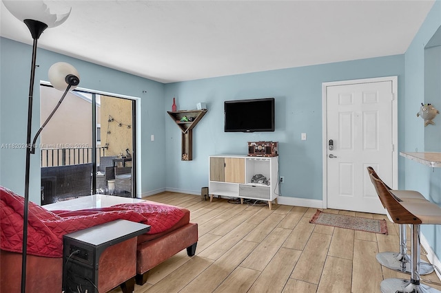251 W Palm Cir W Unit 207, Pembroke Pines, FL 33025 - living area featuring light wood finished floors and baseboards