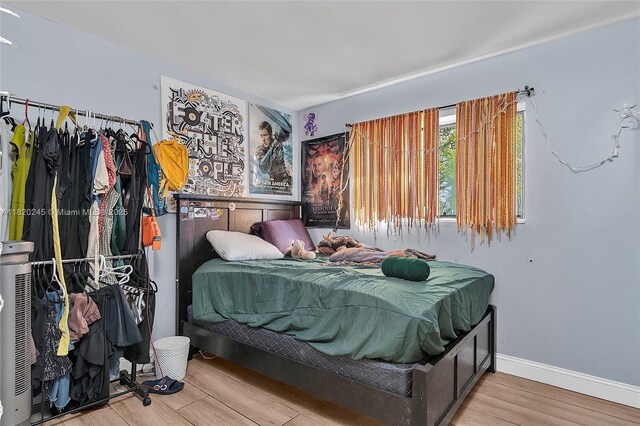 251 W Palm Cir W Unit 207, Pembroke Pines, FL 33025 - bedroom featuring wood finished floors and baseboards