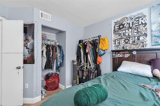 251 W Palm Cir W Unit 207, Pembroke Pines, FL 33025 - bedroom with wood finished floors and a closet