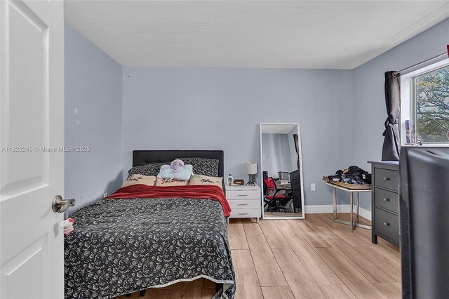 251 W Palm Cir W Unit 207, Pembroke Pines, FL 33025 - bedroom featuring wood finished floors and baseboards
