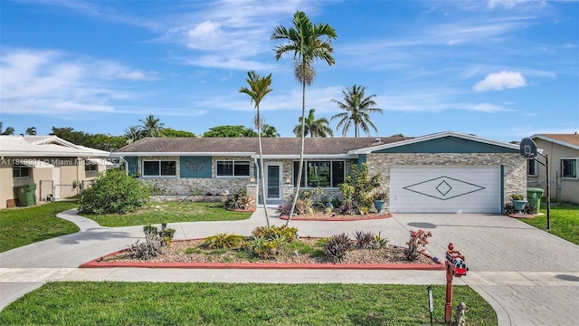 11520 NW 23rd St, Pembroke Pines, FL 33026 - ranch-style house featuring stone siding, driveway, a garage, and a front lawn