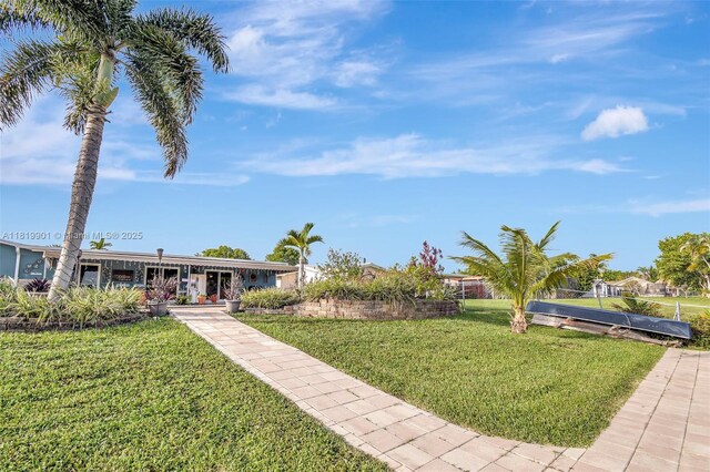 11520 NW 23rd St, Pembroke Pines, FL 33026 - view of green lawn featuring covered porch