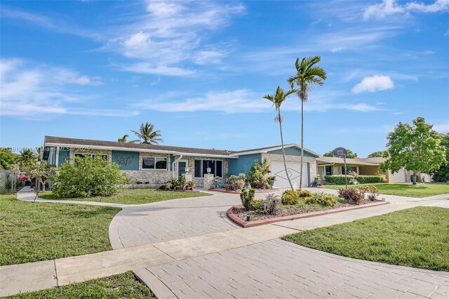 11520 NW 23rd St, Pembroke Pines, FL 33026 - single story home with driveway, a garage, a front yard, and stucco siding