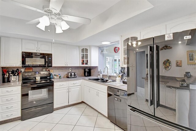 11520 NW 23rd St, Pembroke Pines, FL 33026 - kitchen featuring black appliances, glass insert cabinets, a ceiling fan, tasteful backsplash, and white cabinetry