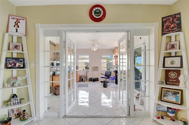 11520 NW 23rd St, Pembroke Pines, FL 33026 - hall with french doors and tile patterned floors