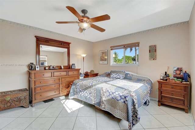 11520 NW 23rd St, Pembroke Pines, FL 33026 - bedroom featuring ornamental molding, a ceiling fan, and light tile patterned flooring