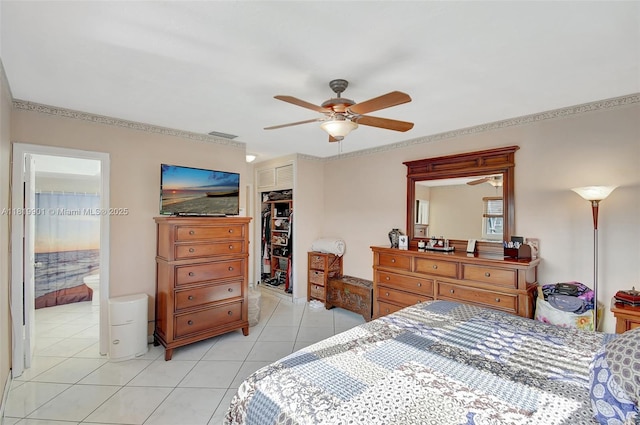 11520 NW 23rd St, Pembroke Pines, FL 33026 - bedroom featuring a closet, light tile patterned floors, a ceiling fan, connected bathroom, and ornamental molding